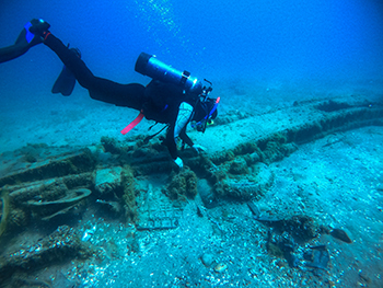 A diver is shown at the wreck site of a Tuskegee Airman's plane on the bottom of Lake Huron.
