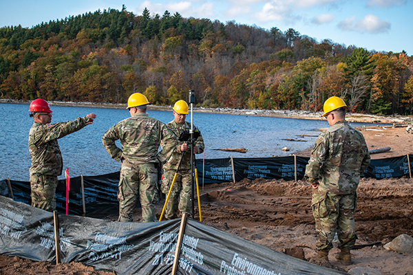 Michigan Army National Guard personnel work along the shore of Silver Lake in Marquette County.