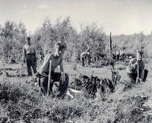 A black-and-white image shows CCC boys planting trees in the 1930s in Michigan.