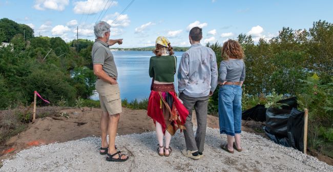 Tourists standing by Boardman Lake Overlook
