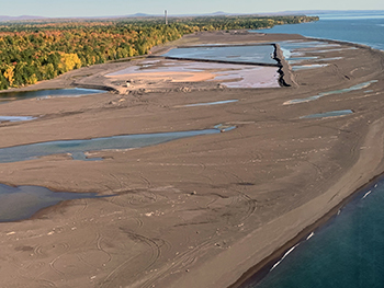 Stamp sands are shown along the Lake Superior shoreline south of the community of Gay.
