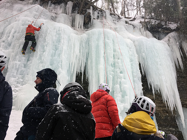 Ice climbers scale an icy rock face in Munising in Alger County.