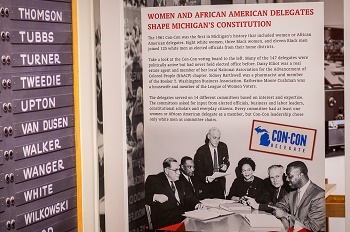 a voting board and black-and-white photo and text explaining Michigan's 1961 Constitutional Convention