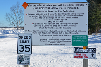 A sign to snowmobilers is shown in Chocolay Township where a 35-mph speed limit is enforced.