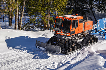 A trail groomer is shown along a trail in Gogebic County.