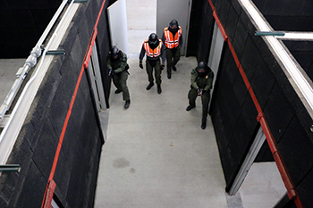 Conservation officers are shown during an active shooter training simulation at the academy.