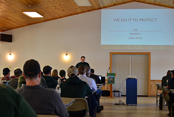 DNR staffers are shown gathered for instruction at a spring tactics meeting in Munising.