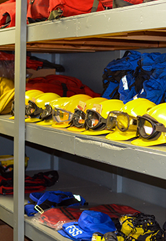 DNR firefighting equipment sits ready on shelves at the Incident Coordination Center in Marquette.