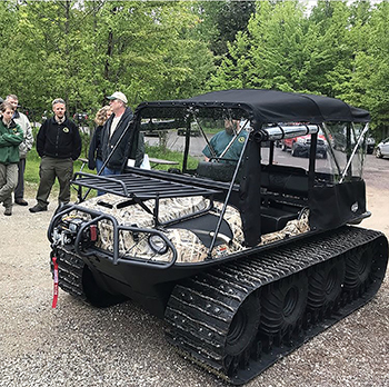 An all-terrain vehicle is shown purchased with money raised by the Friends of the Porkies in the U.P.