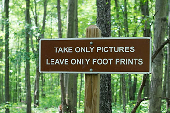 sign saying Take only pictures Leave only footprints