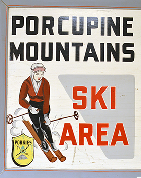 A vintage sign advertises the Porcupine Mountains ski hill.