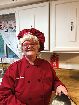 woman dressed in red Mrs. Santa Claus costume