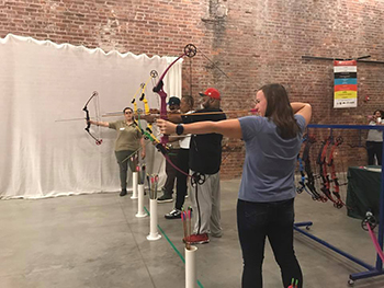 group of archers aiming bows