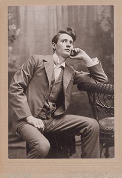 A portrait of the artist seated is shown.