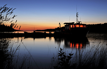 Research vessel Lake Char docked at sunset