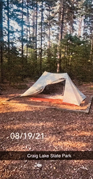 A tent is shown pitched by Dewey Painter in the backcountry at Craig Lake State Park.