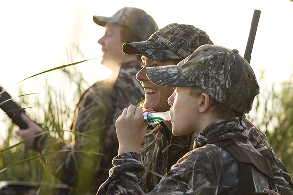 woman and two boys waterfowl hunting