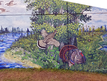 Part of the mural is shown at the DNR Customer Service Center in Escanaba.