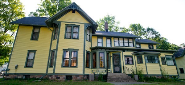 The Mann House, a sprawling, daffodil-yellow historic house.