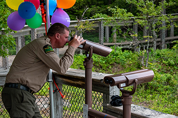 Justin Farley, a park ranger at Porcupine Mountains Wilderness State Park, looks through one of the new viewers at the park.