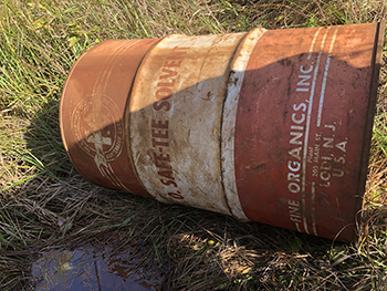 One of two barrels dumped into a drainage ditch near Warner Creek in Marquette County.