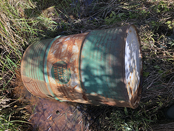 One of two barrels dumped into a drainage ditch near Palmer in Marquette County.