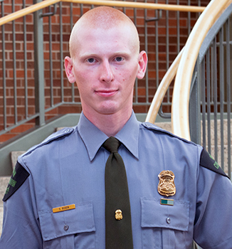 Michigan DNR Conservation Officer Stephen Butzin is shown in his uniform.