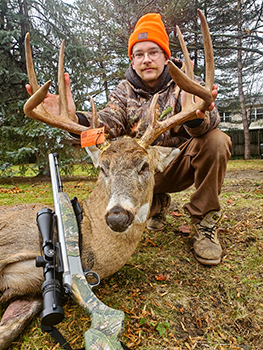 A successful deer hunter is pictured with his buck at the state game area.