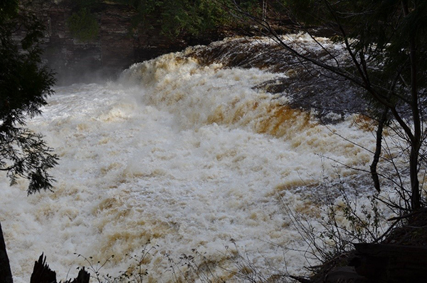 A very of the swollen and raging Presque Isle River in Gogebic County.
