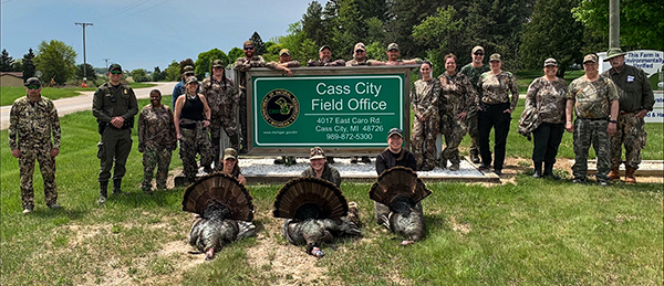 BOW turkey hunt participants and instructors are shown outside the Cass City DNR field office.