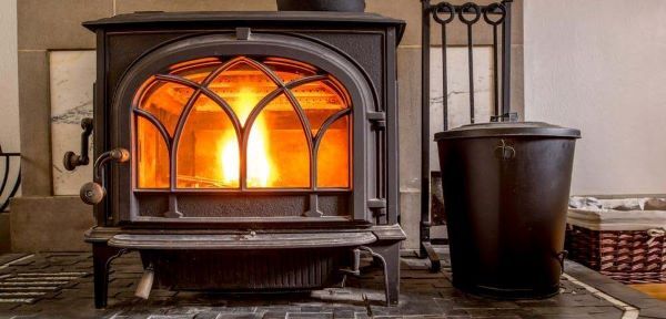 A cheery fire burns in a wood stove