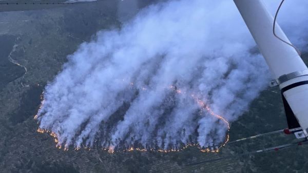 Aerial view of the Goose Marsh fire showing smoke and ring of flames