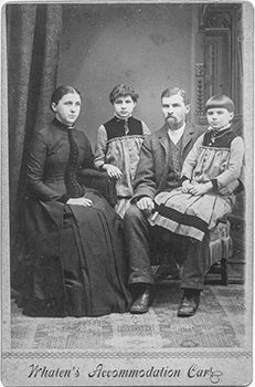 A historic photo of the Mann family is shown.