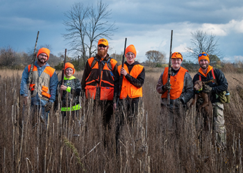 A group of hunters poses for a photo while out hunting in southern Michigan.