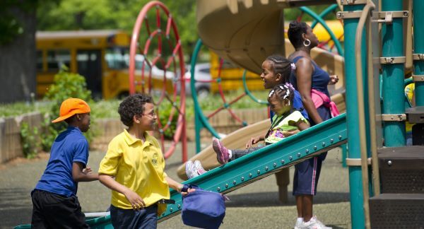 Children playing on the slide at the Belle Isle Park playground