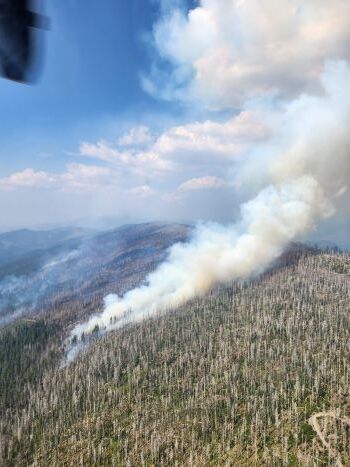 Flames and smoke climb up a hillside during a northern California wildfire. 