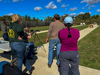 Women practicing shooting at a shooting range.