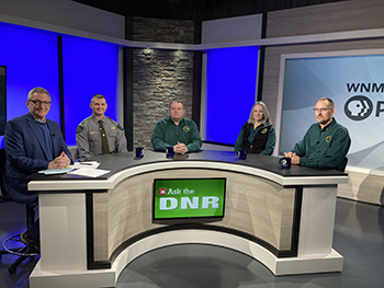 Guests from a previous show pose for a photo on-set with "Ask the DNR" host Mike Settles.