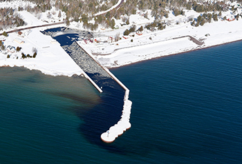 An aerial winter view of Grand Traverse Harbor is shown.
