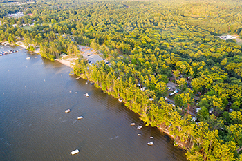 bird's-eye view of campground and sandy shoreline
