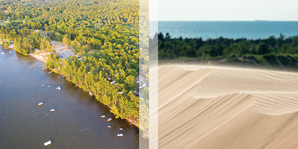 bird's-eye view of sand dunes, campground and lakeshore with boats