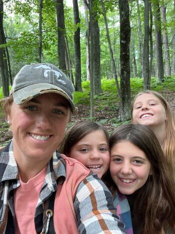 Jenilee Dean and her children enjoy a workday in the woods