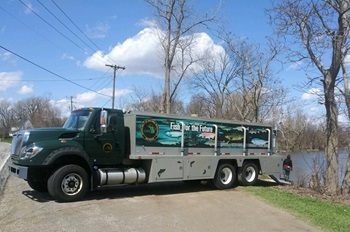 A DNR fish stocking truck readies to release its payload of fish into a waterbody.