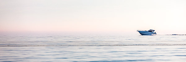 boat skimming across water