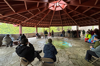 Group gathered at Straits State Park for the groundbreaking and blessing of the grounds for new project. 