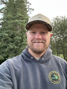 Wildlife technician Don Brown smiles for the camera.