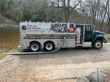 Michigan DNR fish-stocking truck at Tippy Dam on Manistee River.