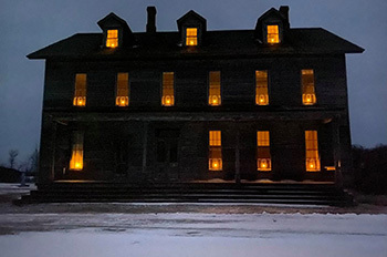 historic building with orange lighting in windows