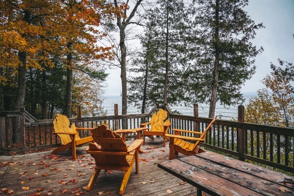 Michigan-shaped chairs positioned around a campfire ring.