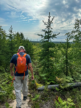 A hiker makes his way along a Lake Superior stretch of the North Country National Scenic Trail.